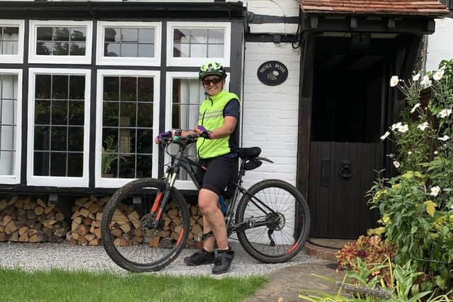 Angie returning home from a muddy training ride