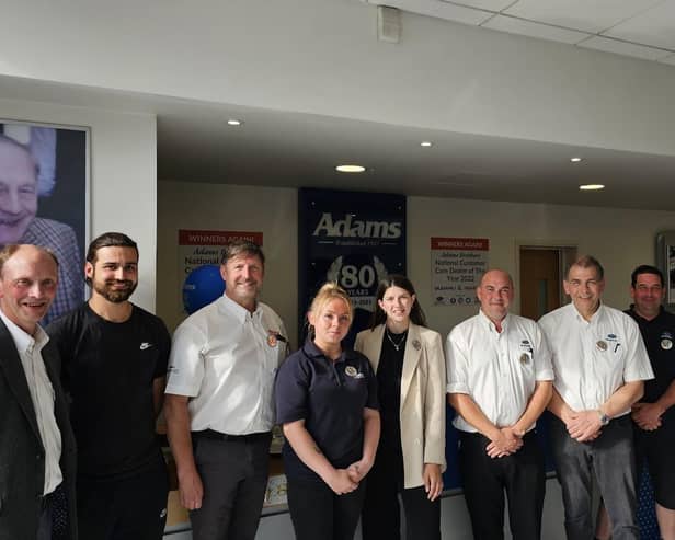 Adams Brothers team photo, including: