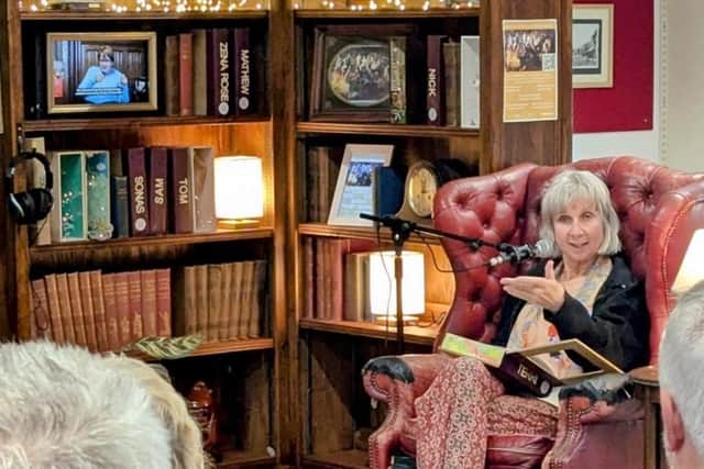 Terri Winchester from the Freewheelers Theatre & Media Company introducing the interactive bookcase art installation.