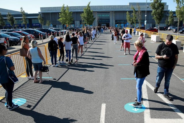 Thousands of shoppers were seen queuing for reopened shops in England