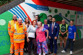 Volunteers, supporters, the mayor, and the artist, were all present to open the new mural.