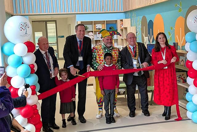 Cutting the ribbon from left - Jon Mason, chief executive of Inspiring Futures Partnership Trust, Carl Jackson, cabinet member for education and children's services, Andy Collins (Lester the Jester), John Chilver, chairman of Buckinghamshire Council, Liz Jones, head of Orchard View Primary Academy