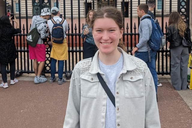 Lydia outside Buckingham Palace
