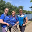Karen Ironside and Emma Courtnadge walking along the scenic river path with Clare Balding