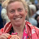 Karen Ellis photographed with her medal at the TCS London Marathon 2024