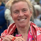 Karen Ellis photographed with her medal at the TCS London Marathon 2024