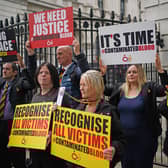 People demonstrate as relatives of victims of the NHS infected blood scandal hand in a letter to 10 Downing Street pleading with Prime Minister Rishi Sunak that "action is needed now" to set up a body to give full compensation. INQUIRY Blood Bereaved Families.photo from: Victoria Jones/PA Wire