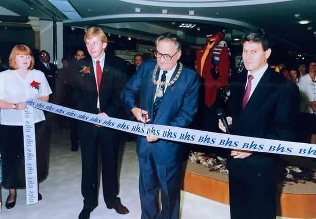 The Mayor of Aylesbury cuts the ribbon with store manager Tony Pearson, left, and Keith Edelman the new Group Chief Executive of Storehouse