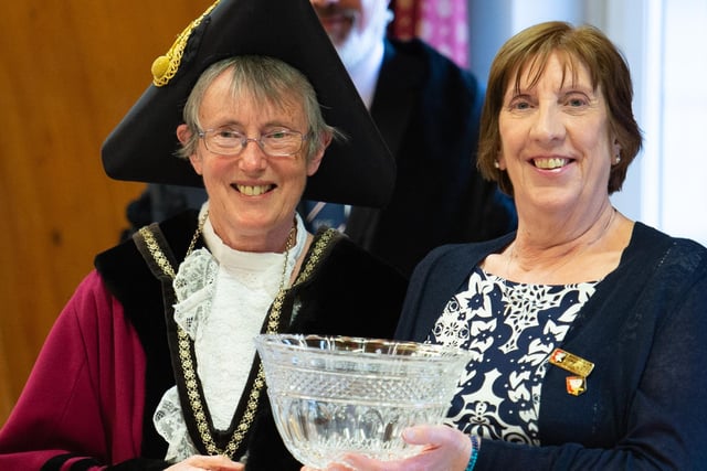 Cllr Geraldine Collins receives a crystal bowl from Mayor Cllr Margaret Gateley