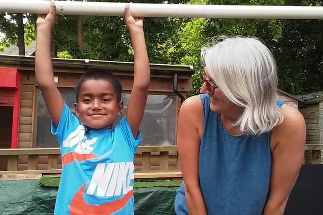Mrs. Rolfe with 5-year-old Haider Rahman
