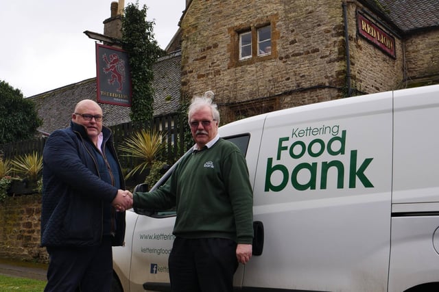 Richard Gordon of Greedy Gordons with Kettering Foodbank volunteer driver Ken Ansdell.
