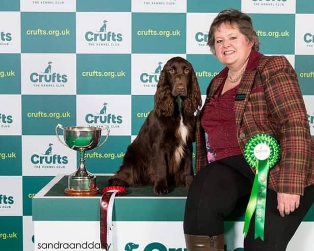 Ester on the podium with Gretel at Crufts 2023