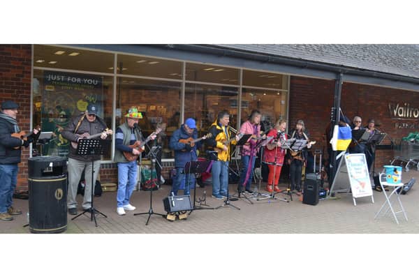 Buckingham Ukulele Group busking outside Waitrose