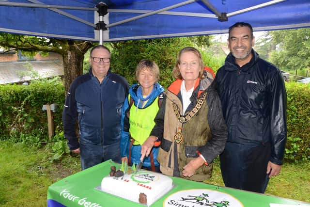 The cake cutting. From left: Clive Harriss, Fiona Broadbent, Patricia Birchley, Zahir Mohammed