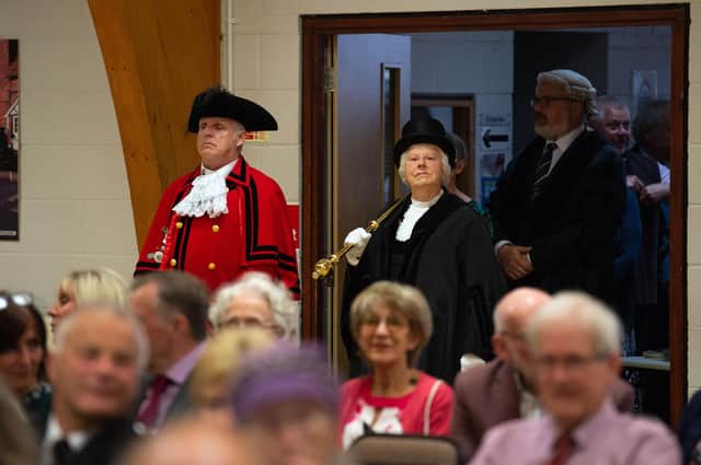 The town council procession enters the hall
