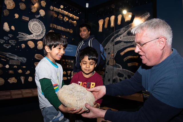 Neel (six) and Brij (four) are shown an ammonite