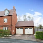 The property offers double garage with electric doors and parking for two vehicles