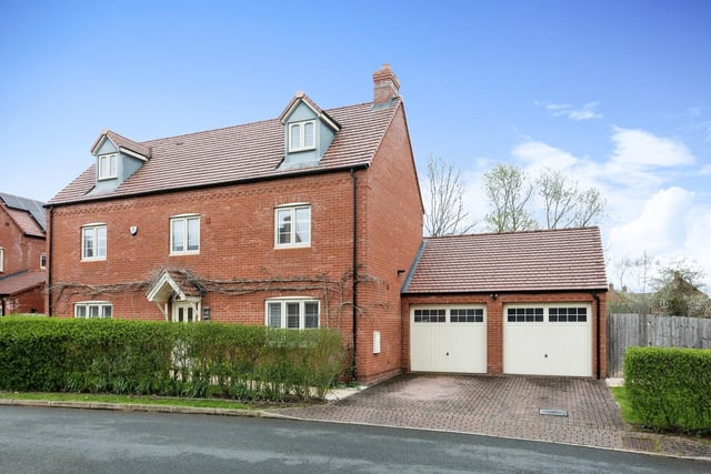 The property offers double garage with electric doors and parking for two vehicles
