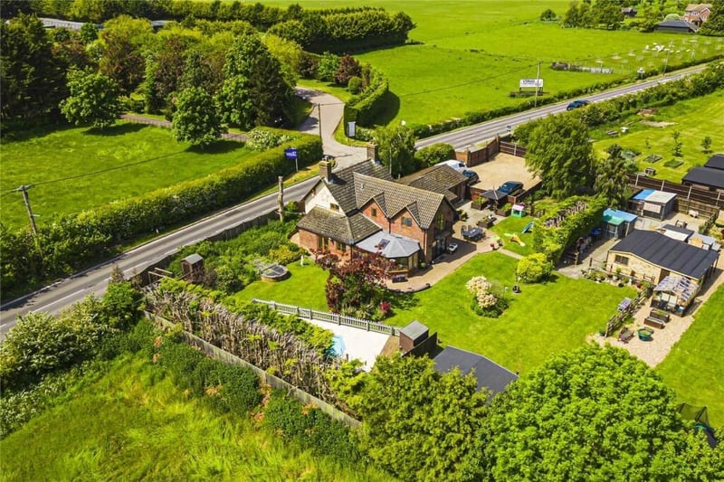 From this angle, you can see the house, two double garages, refurbished pool, outbuildings and garden!