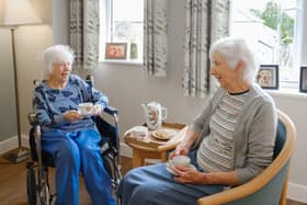 Residents at a Fremantle Trust care home enjoying a cup of tea.