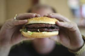 A half-pounder burger and chips in a takeaway carton. Photo from Philip Toscano/PA Images