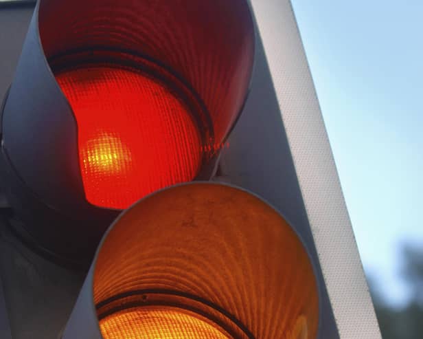 traffic lights showing amber and red at a crossroads, UK. (Photo by Adrian Sherratt/Construction Photography/Avalon/Getty Images)