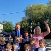 Councillor Steven Broadbent and Headteacher, Eileen Stewart, with pupils at the new crossing