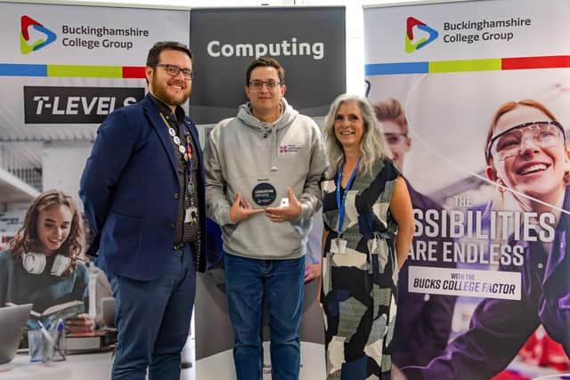Sean Bastow (left) & Tracey Matthews (right) present James Scudder (centre) with Cornerstone Employer plaque.