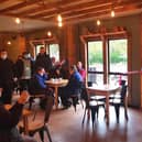Greg Smith MP opens the Potting Shed Cafe with general manager Matt Philcox and adult care clients Matthew and Glen