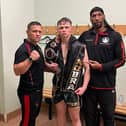 Brandon Cook after his win, alongside Stephen Cook and Michael Graham.