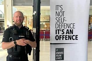 PC Kevin Simmons with the screening arch which has been passed through by thousands of students at secondary schools across Milton Keynes