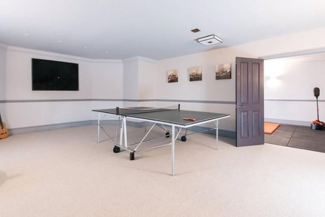A spacious games room complete with a table tennis table, there is plenty room for more activities.