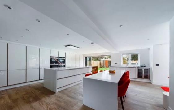 The modern open plan, expansive kitchen and dining area in the property.