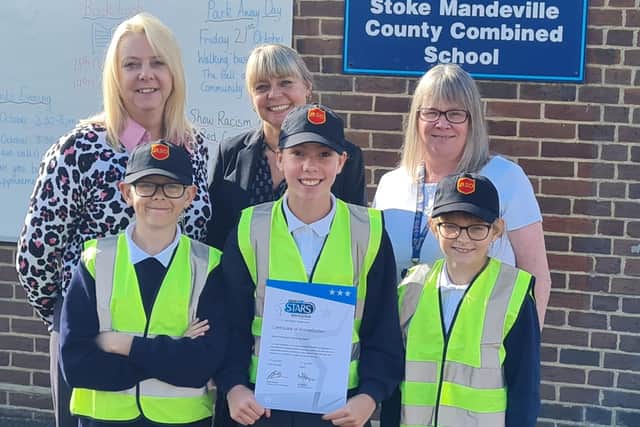 Students from Stoke Mandeville Combined School holding their Modeshift STARS Certificate of Accreditation