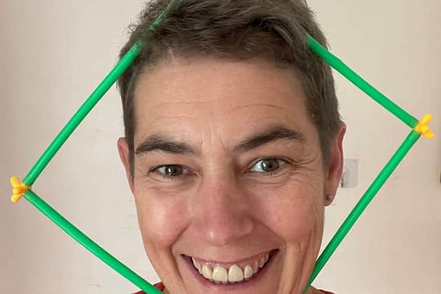 Let Teachers SHINE winner Jayne Webster wearing some physical maths manipulatives.
