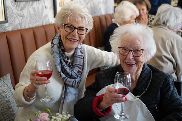 A Clarendon House resident enjoys the celebrations with her daughter