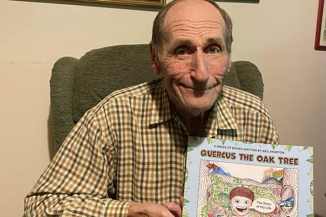 Neil Morton with his book