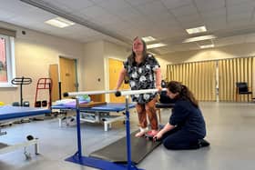 Penny Munro being supported by Lucy Sharpe, one of the physios at the Chilterns Neuro Centre.