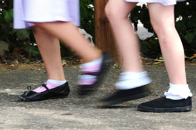 File photo of school girls walking to school.