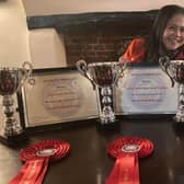 Pie chef Rodelia Manley with her awards at the Bell Hotel and Pie Shop