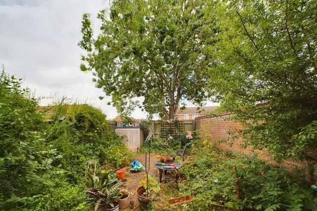 The property enjoys an enclosed rear garden