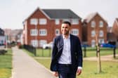 Callum Anderson MP walking through a new-build housing estate