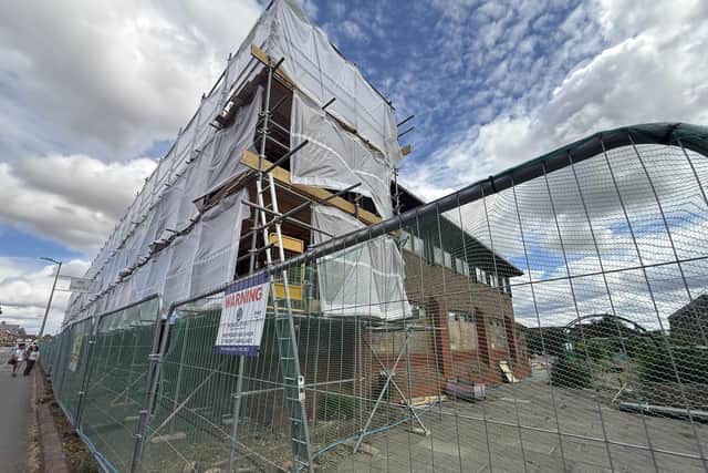 Scaffolding, safety fencing and protective sheeting erected around the former council offices in Amersham. Credit: Nathaniel Lawson/LDRS