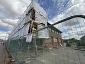 Scaffolding, safety fencing and protective sheeting erected around the former council offices in Amersham. Credit: Nathaniel Lawson/LDRS
