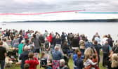 The Red Arrows dazzle spectators with their diamond nine aerobatic display across the shores of Belfast Lough