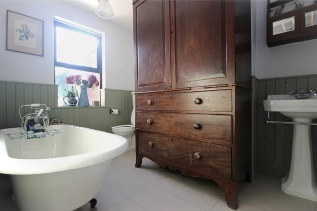The bathroom with freestanding rolltop bath