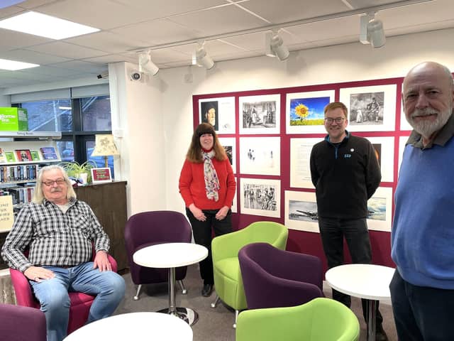 From left: Committee member Mike Smith and trustees Ruth Newell, Warren Whyte and Roger Edwards formally open the light installation.