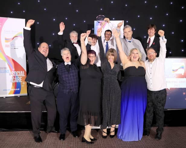 Hightown's VoiceBox group receiving their Great British Care award