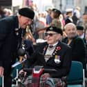 Veterans reminiscing, photo by Derek Pelling
