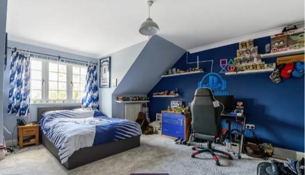 This bedroom clearly belongs to a big gamer.